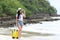 Happy traveler and tourism young women travel summer on the beach.Â 